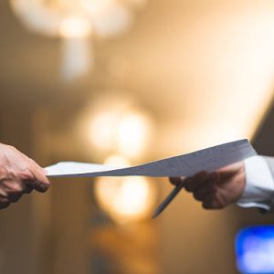 Hands of business people passing important document
